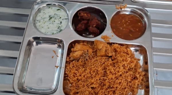 Indian meal — chicken biryani thali at BMTU